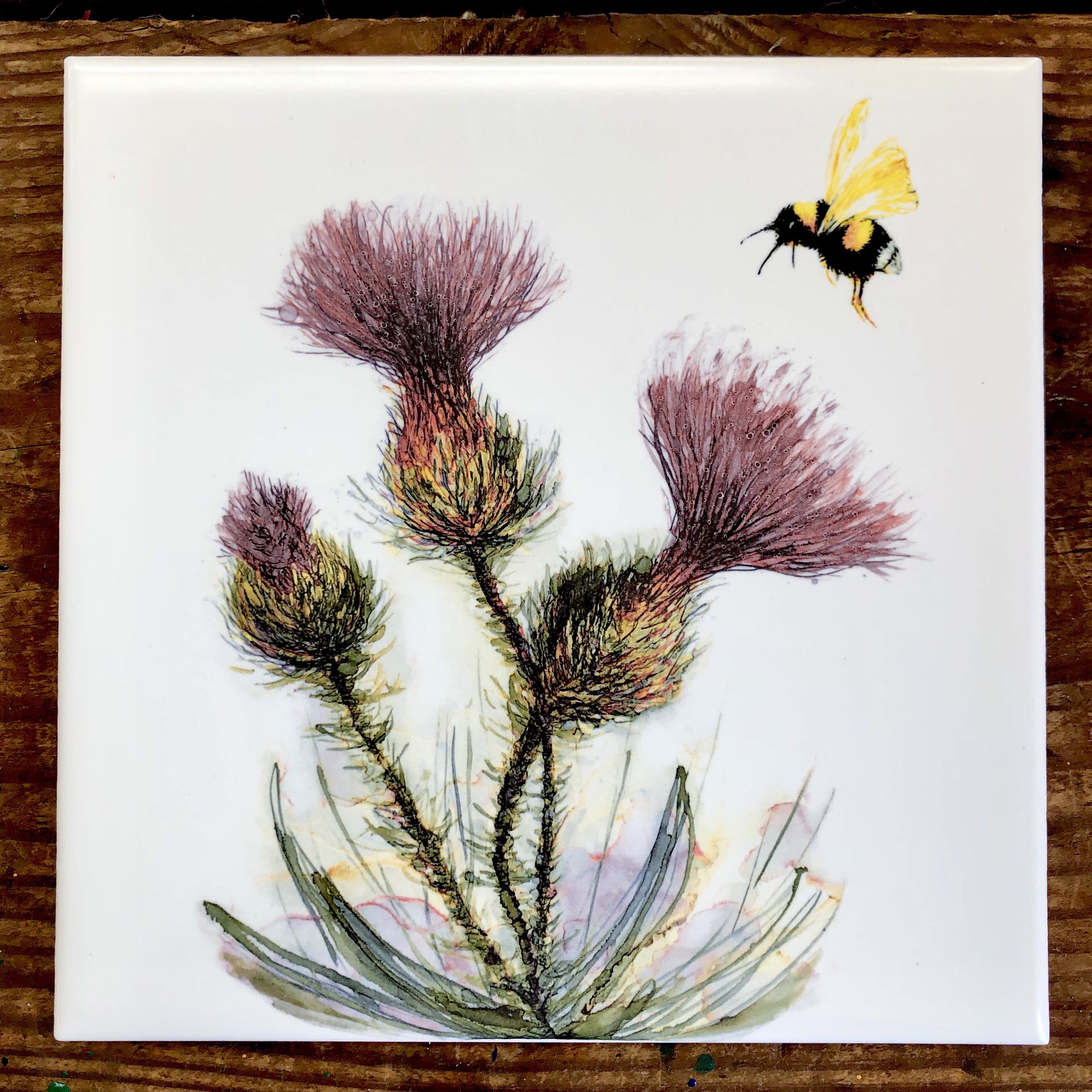 Thistle and Honeybee Ceramic Tiles showcasing intricate designs, perfect for indoor and outdoor decor.