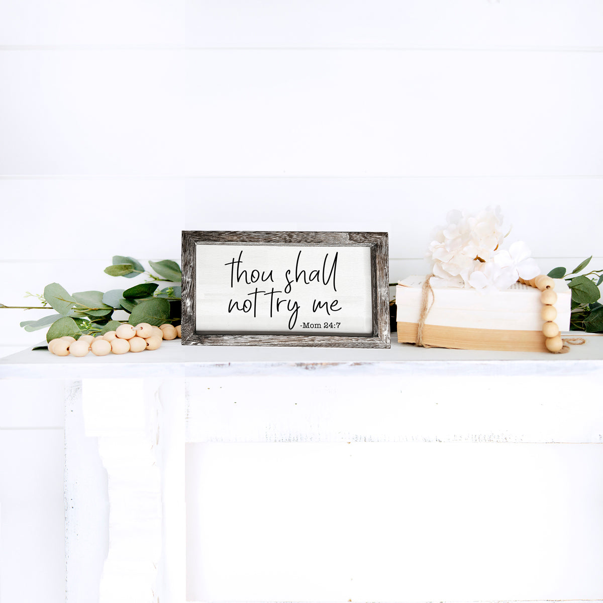 A humorous wooden sign reading 'Thou Shall Not Try Me Mom 24:7', crafted from premium Paulownia wood, featuring a stylish frame.