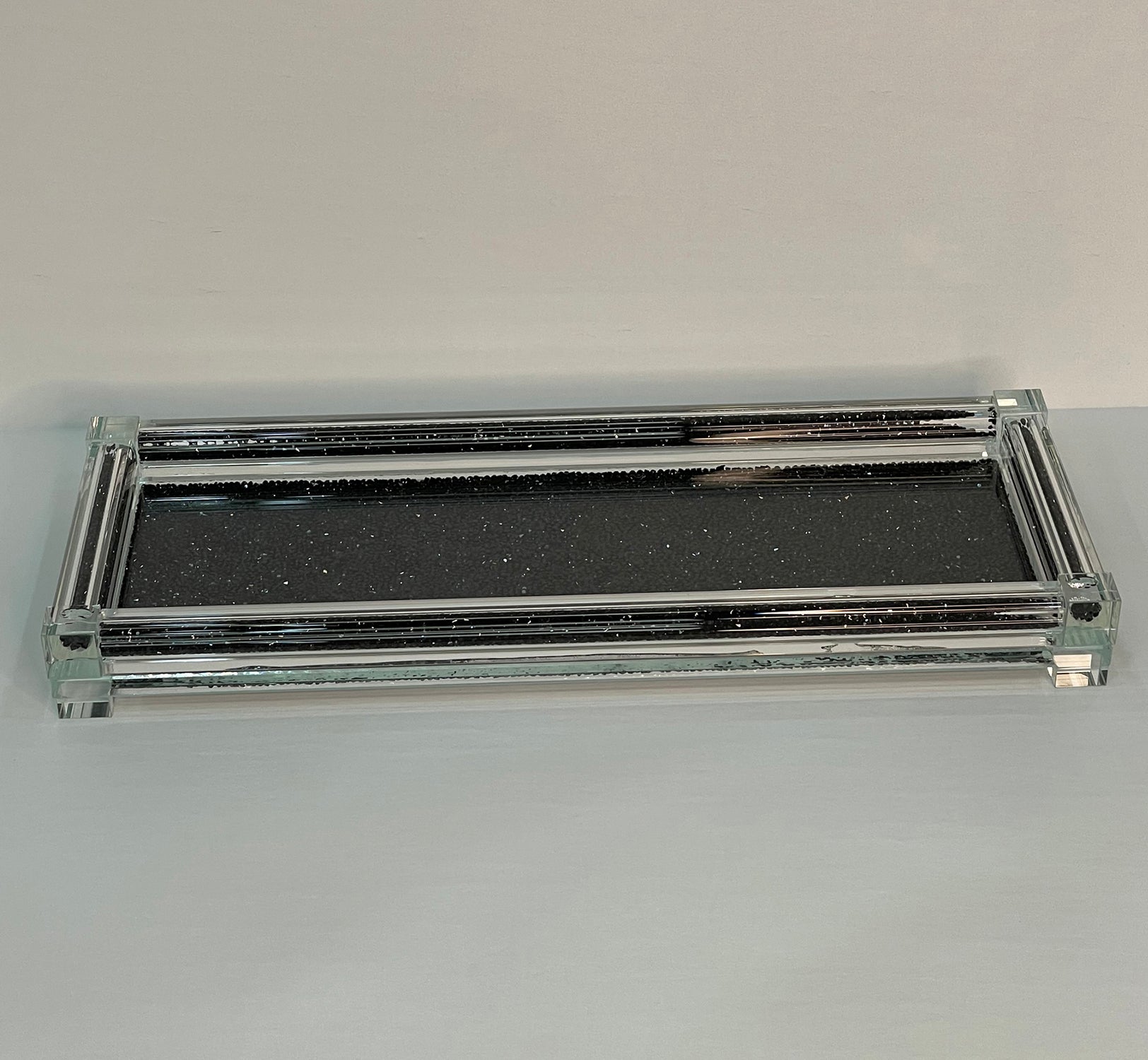 Three glass canisters on a tray, featuring black crushed diamond glass design with elegant glass lids.