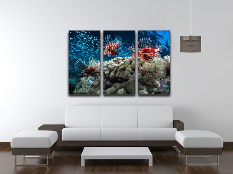 Three-panel canvas print featuring lion fishes and bait fish in a vibrant underwater scene.