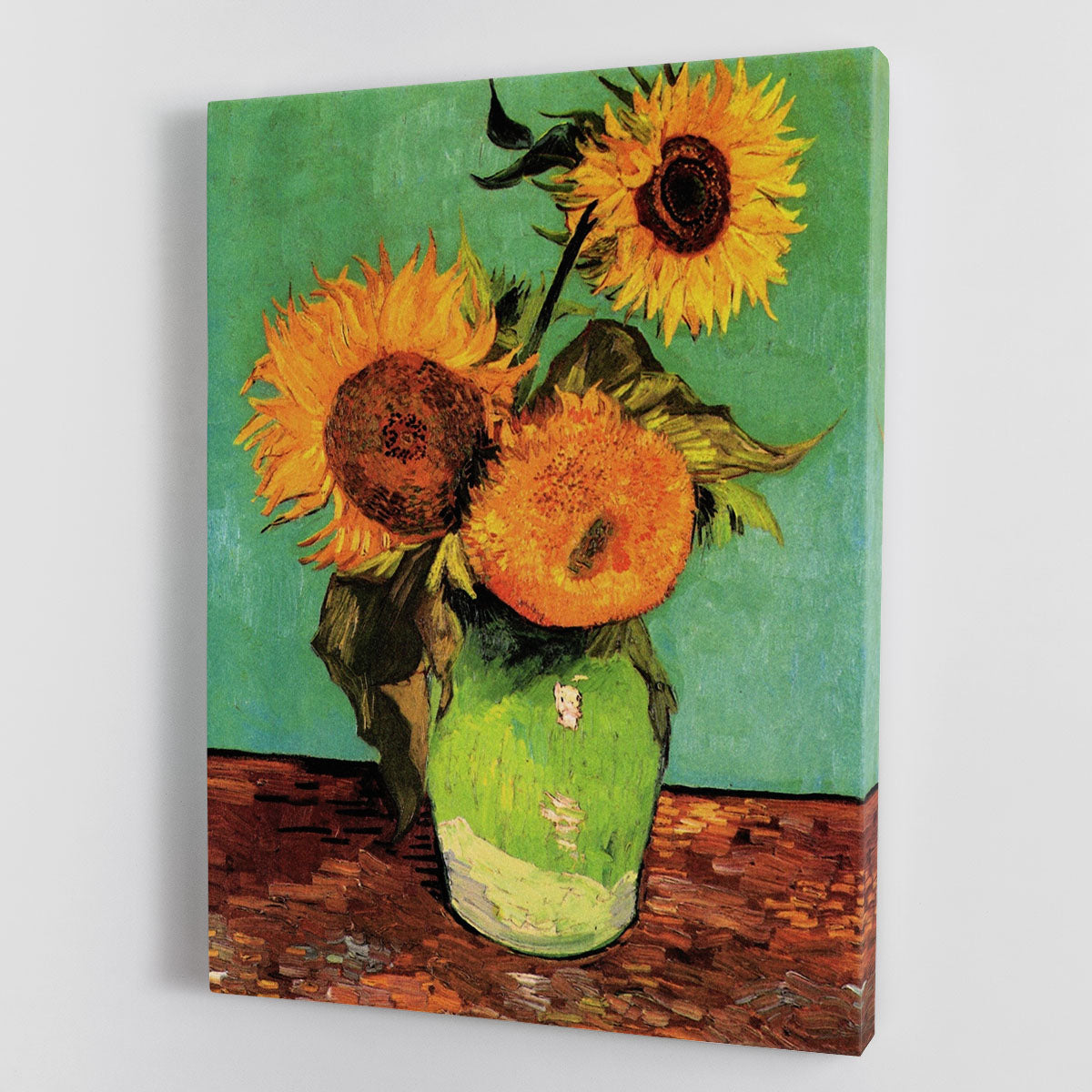 Canvas print of Van Gogh's Three Sunflowers in a Vase, showcasing vibrant yellow flowers in a classic vase.