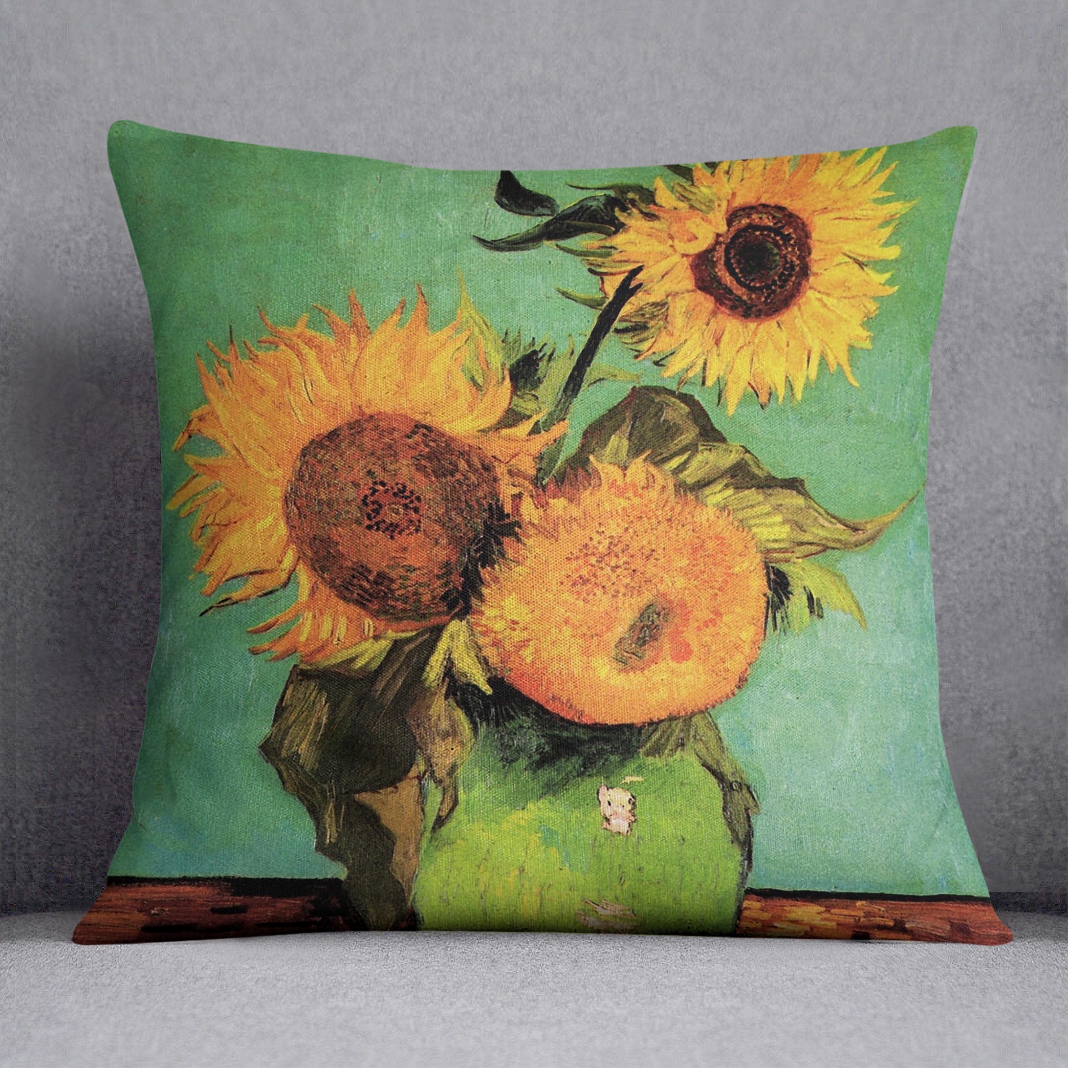 A vibrant cushion featuring Van Gogh's Three Sunflowers in a Vase design, made from luxurious vegan faux suede.