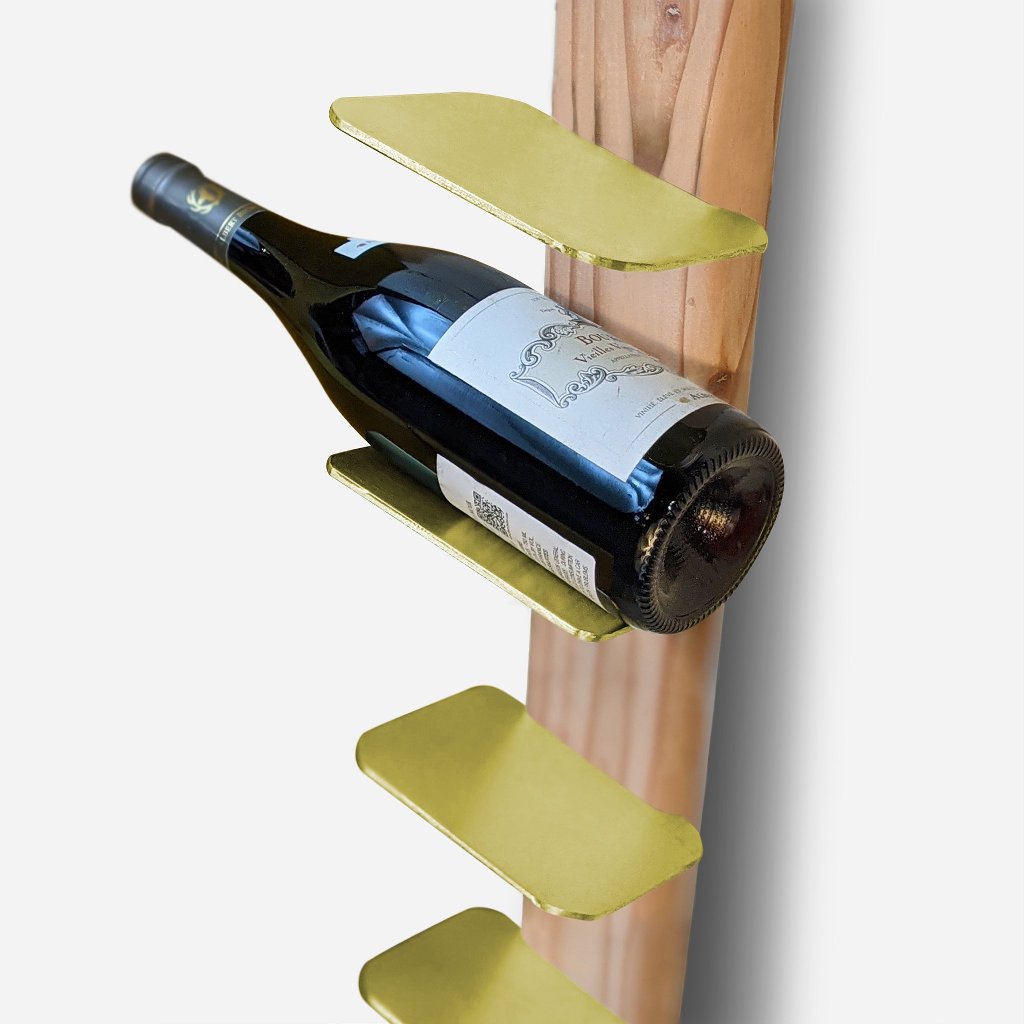 Stylish TIPsy wine rack displaying wine bottles, crafted from repurposed wood with brushed brass accents.