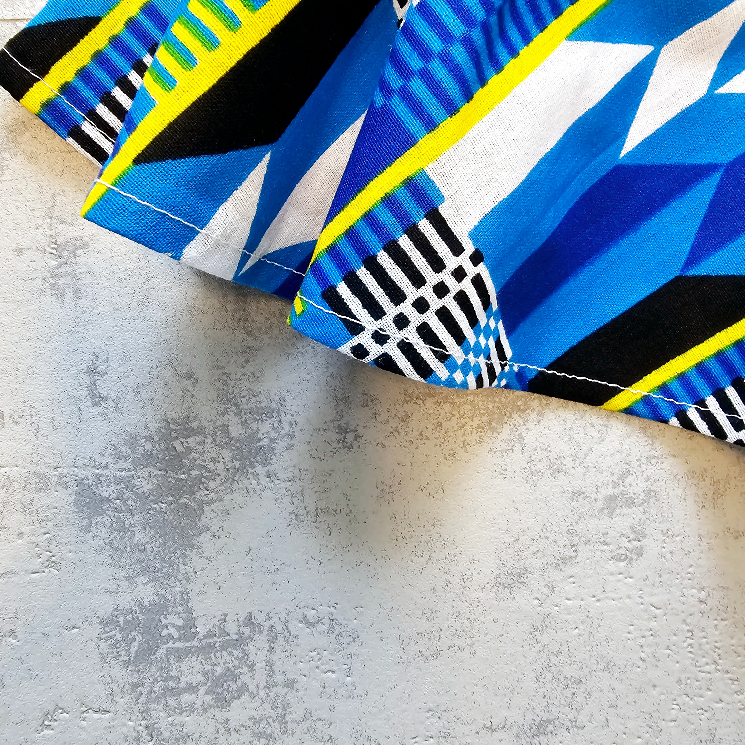 A vibrant Toddler Circle Skirt made from Ankara fabric, featuring a colorful design and an elastic waist, perfect for playful little girls.