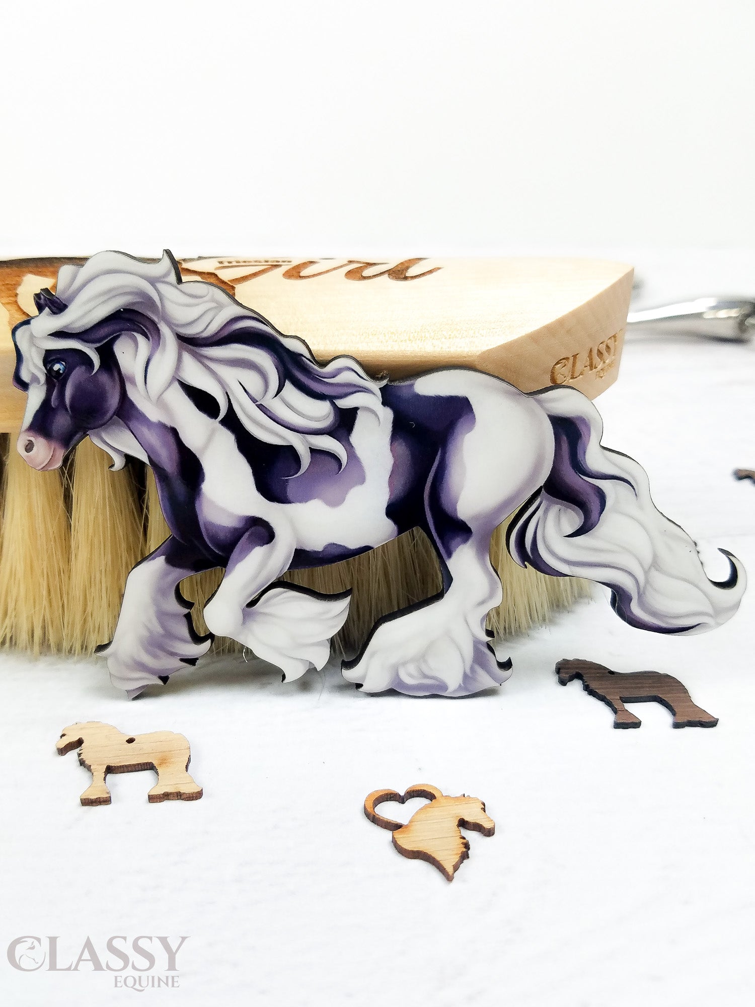 Traditional Cantering Tobiano Gypsy Horse Ornament in black and white, handmade from composite wood with a ribbon for hanging.