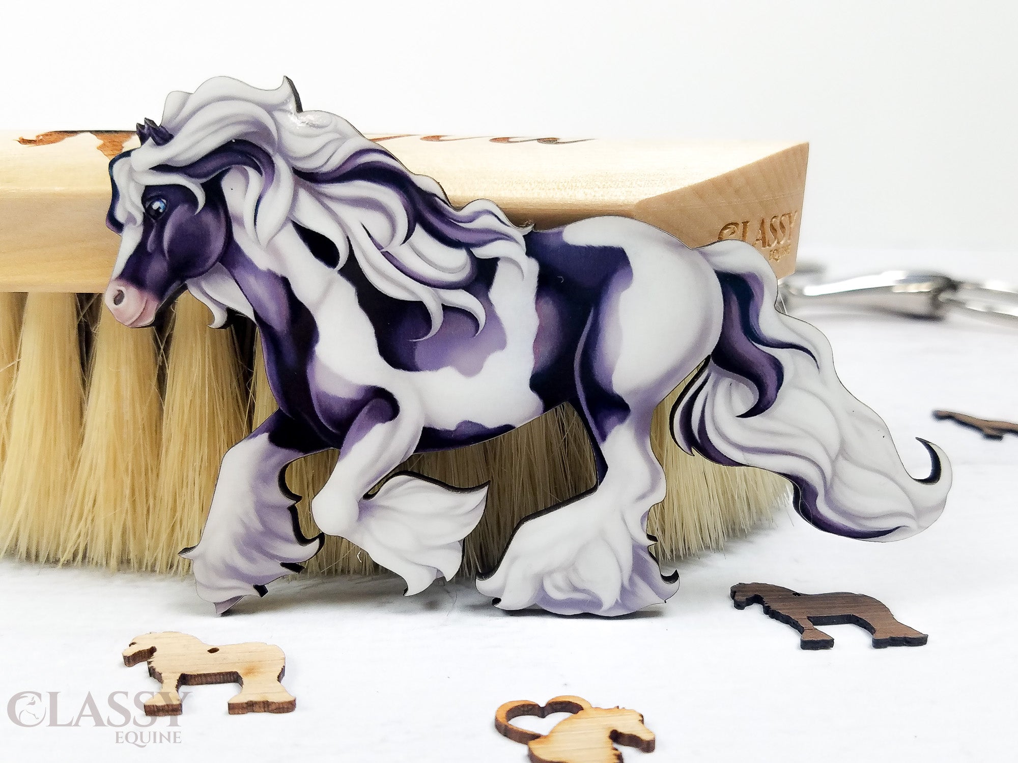 Traditional Cantering Tobiano Gypsy Horse Ornament in black and white, handmade from composite wood with a ribbon for hanging.