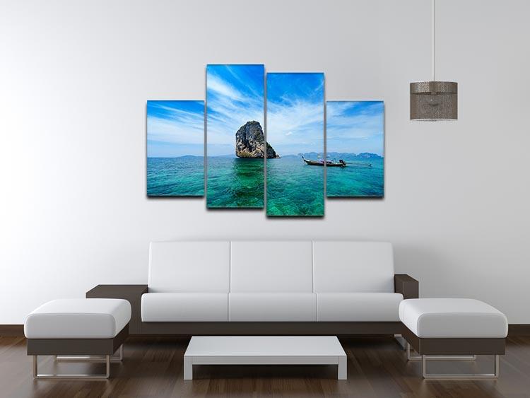 A beautiful 4-split canvas artwork featuring a traditional Thai boat on a vibrant blue sea, showcasing intricate details and serene colors.