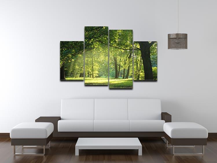 A beautiful 4-split canvas artwork depicting trees in a vibrant summer forest, showcasing lush greenery and a serene atmosphere.