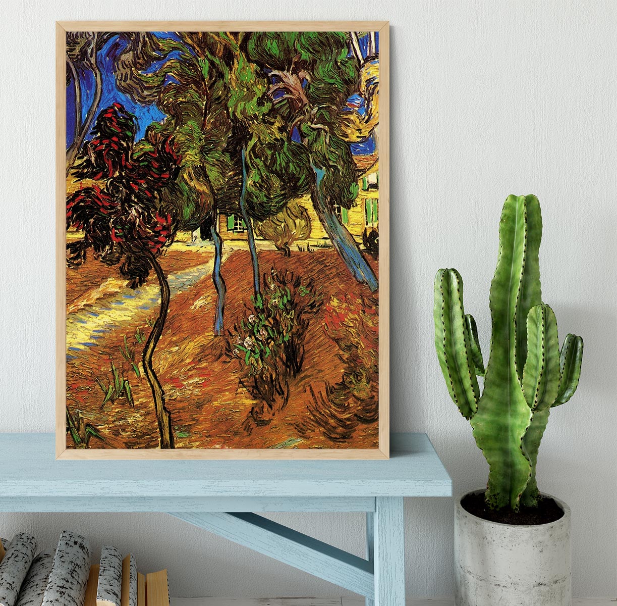 Framed print of Van Gogh's Trees in the Garden of Saint-Paul Hospital 2, showcasing vibrant colors and intricate details.