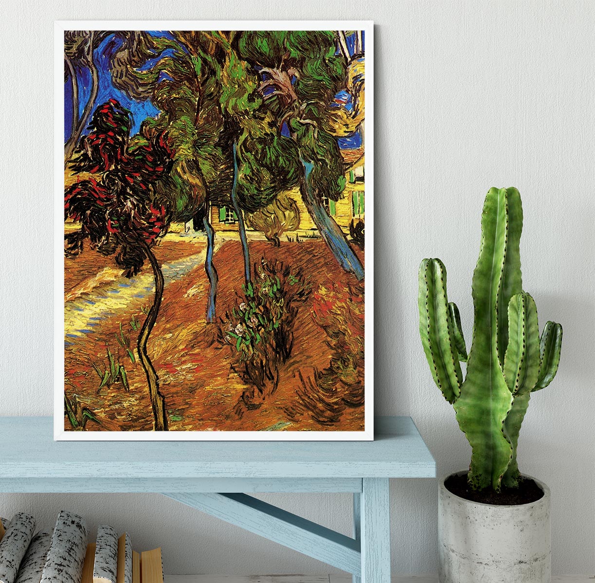 Framed print of Van Gogh's Trees in the Garden of Saint-Paul Hospital 2, showcasing vibrant colors and intricate details.