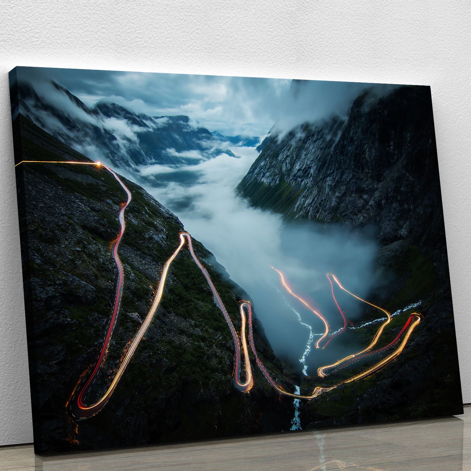 A beautiful Trollstigen canvas print showcasing Norway's scenic landscape with winding roads and lush greenery.