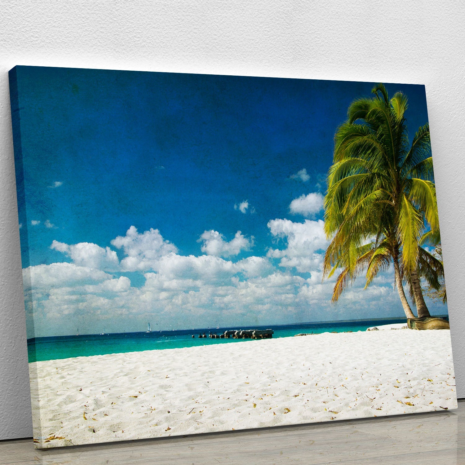 A vibrant tropical beach canvas print featuring palm trees, golden sand, and turquoise waters, perfect for home decor.