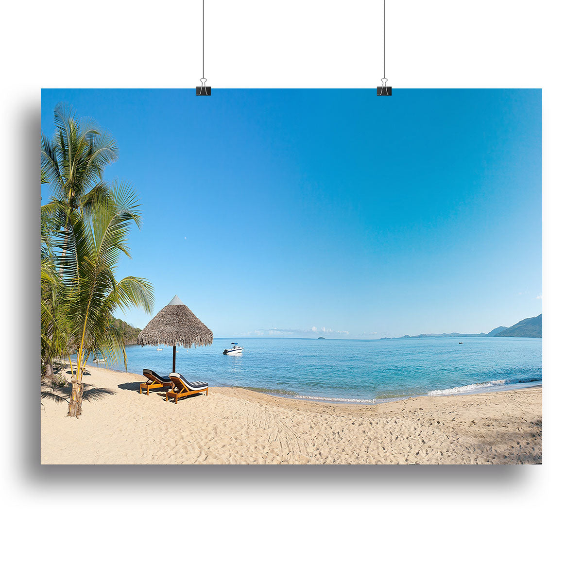 A vibrant canvas print of a tropical beach panorama featuring deckchairs under a clear blue sky, perfect for home decor.