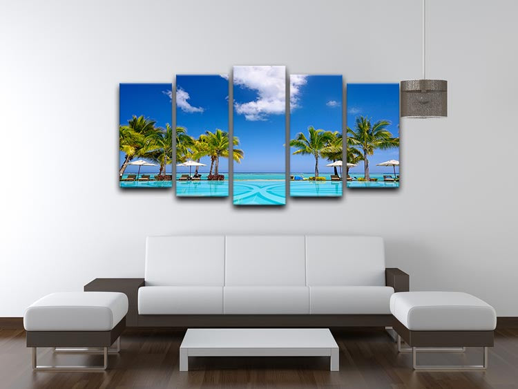 A stunning 5-panel canvas artwork depicting a tropical beach resort with lounge chairs, showcasing vibrant colors and serene scenery.