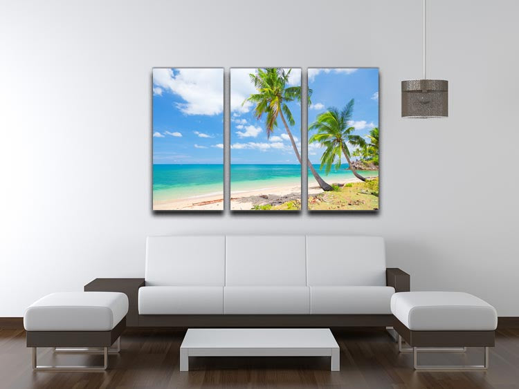 A beautiful 3-panel canvas print depicting a tropical beach scene with coconut palms swaying in the breeze, perfect for home decor.
