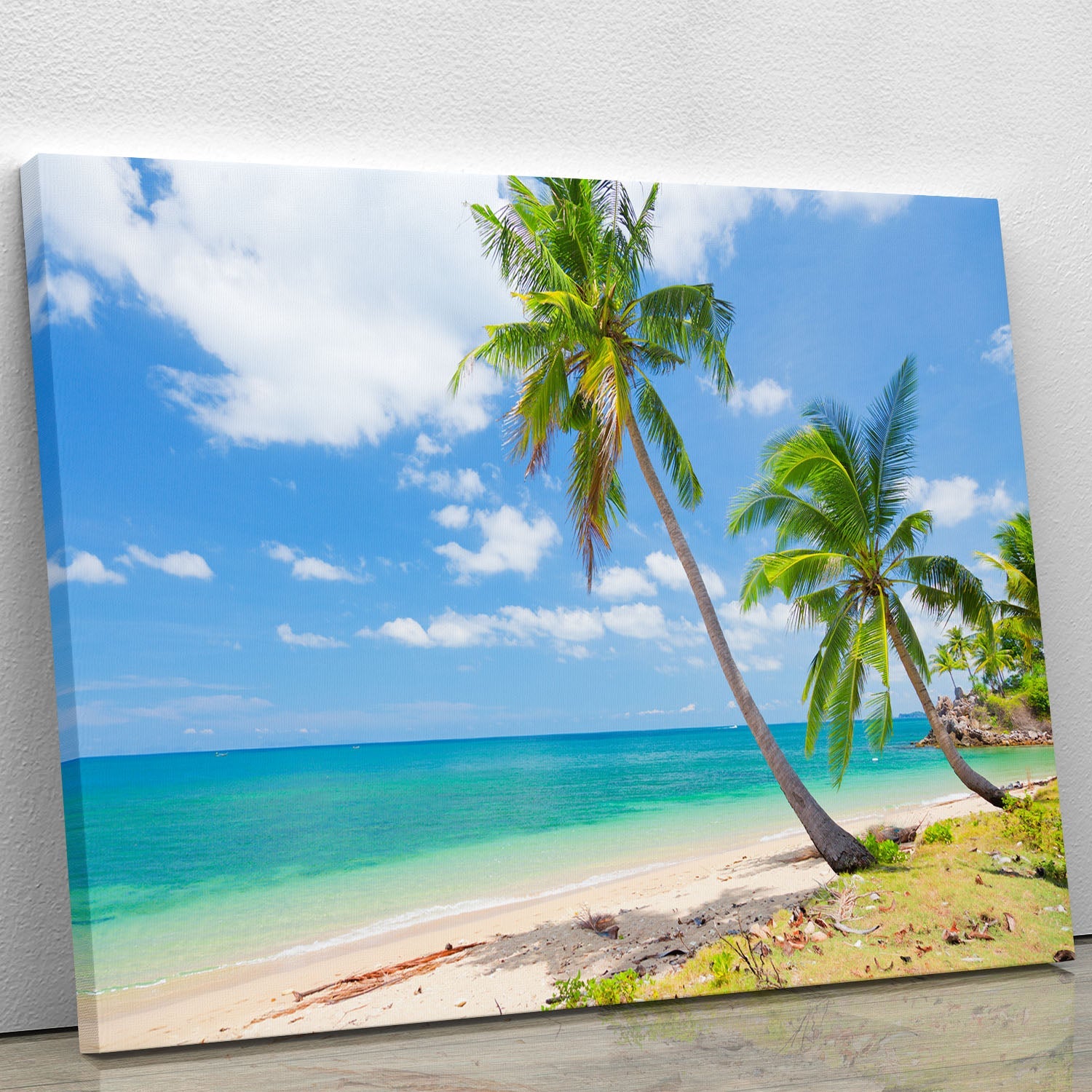 A vibrant canvas print of a tropical beach featuring a coconut palm, showcasing serene blue waters and a clear sky.