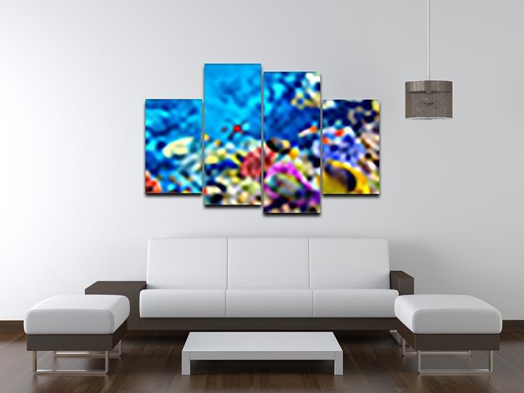 A vibrant 4-panel canvas artwork featuring colorful tropical fish, creating a dynamic ocean scene.