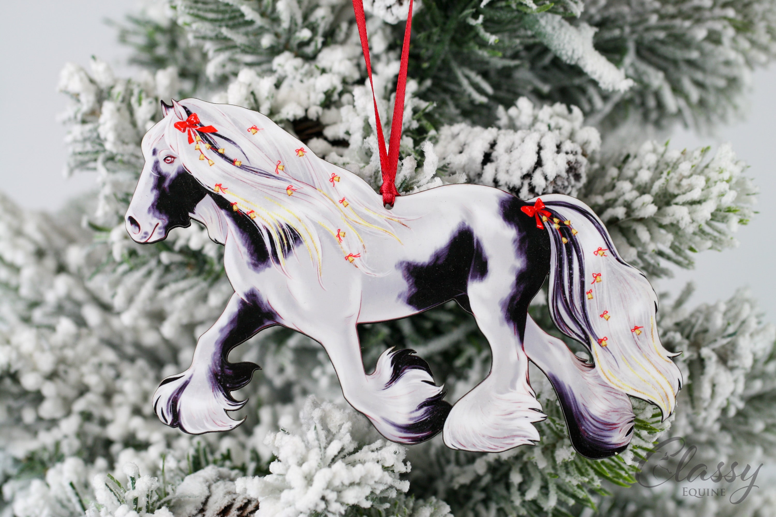 Handmade Trotting Black and White Tobiano Gypsy Vanner Horse Christmas Ornament with a decorative wreath, perfect for holiday decor.
