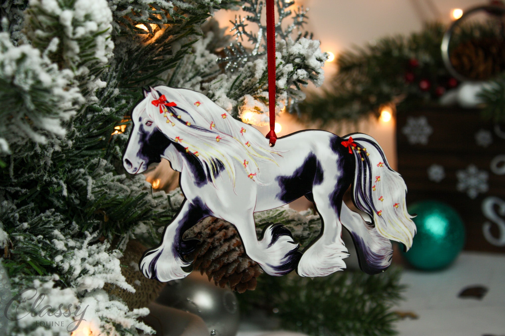 Handmade Trotting Black and White Tobiano Gypsy Vanner Horse Christmas Ornament with a decorative wreath, perfect for holiday decor.