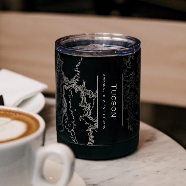 Matte black insulated cup featuring a custom engraved map of Tucson, Arizona with coordinates.