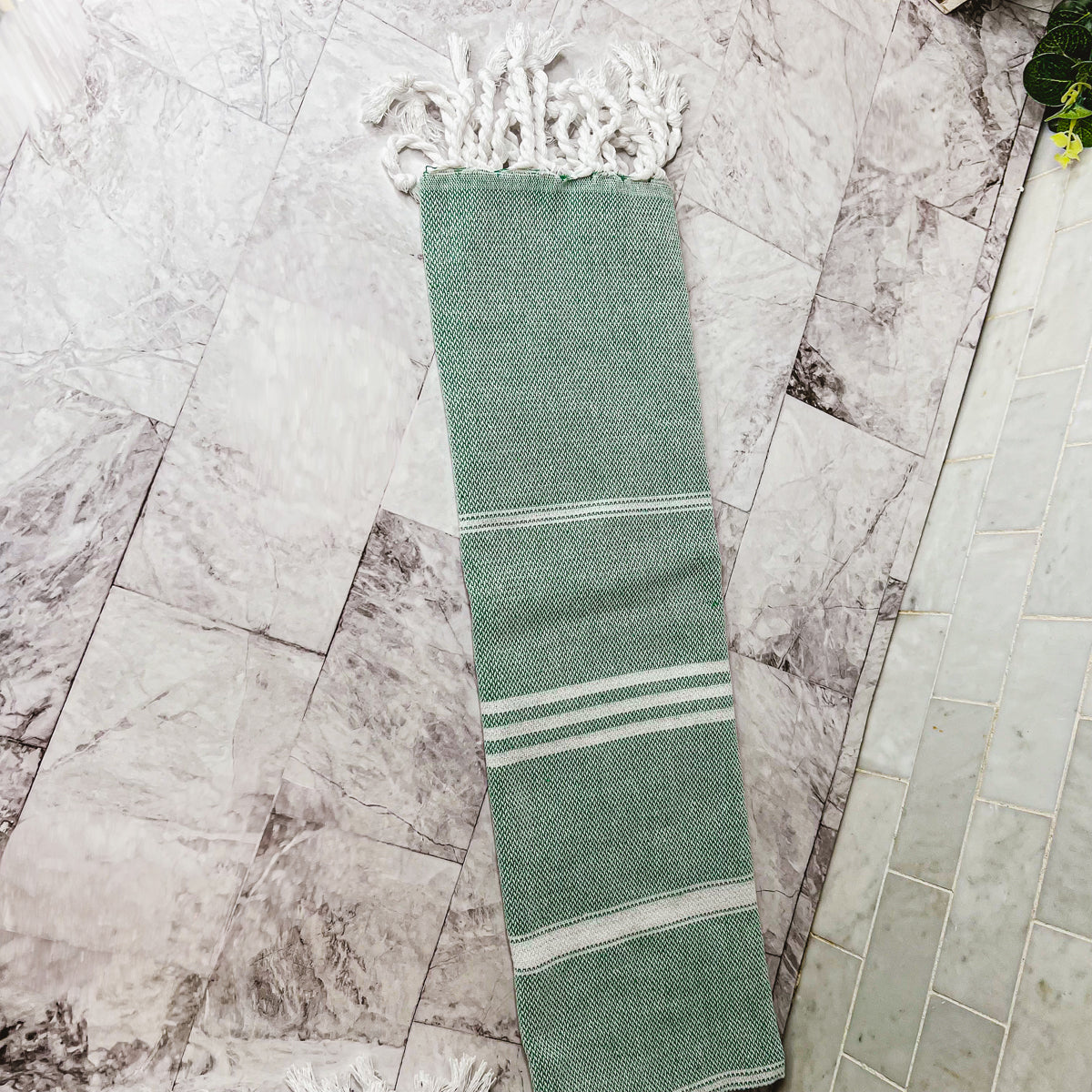 Luxurious oversized Turkish hand towel with bamboo tassels, showcasing vibrant colors and elegant design.