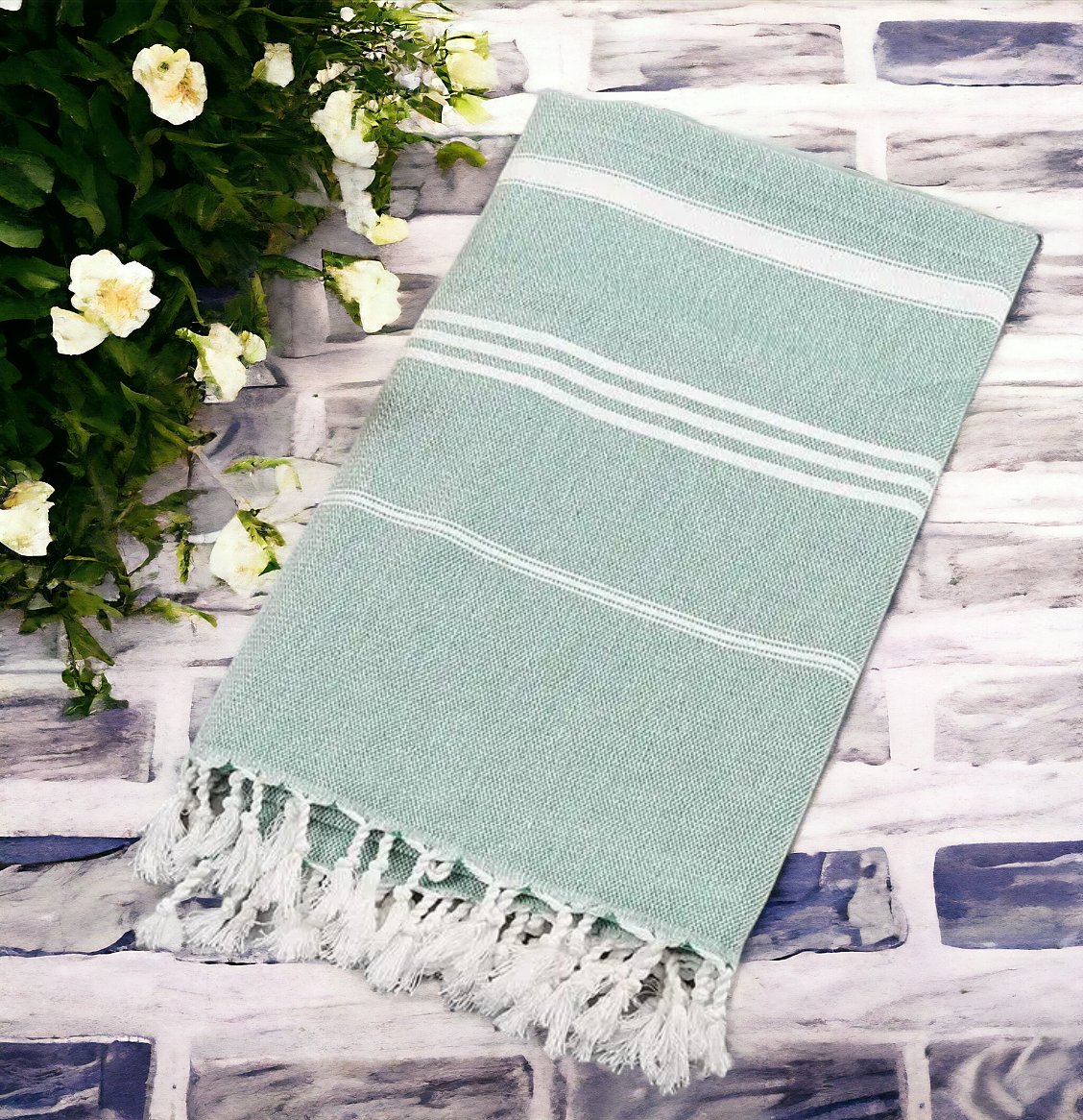 Luxurious oversized Turkish hand towel with bamboo tassels, showcasing vibrant colors and elegant design.