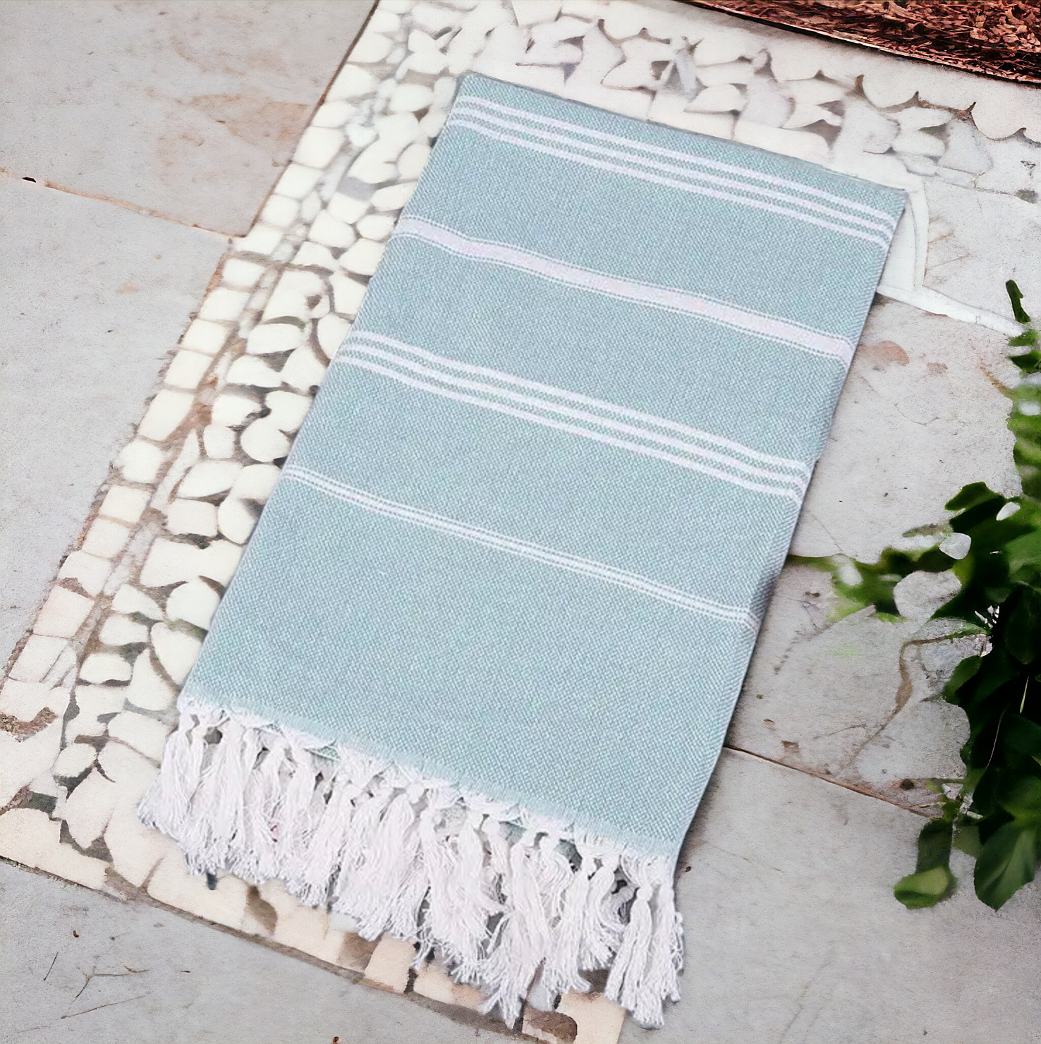Luxurious oversized Turkish hand towel with bamboo tassels, showcasing vibrant colors and elegant design.