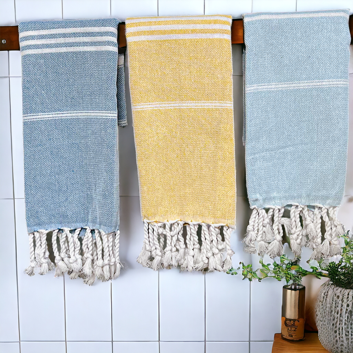 Luxurious oversized Turkish hand towel with bamboo tassels, showcasing vibrant colors and elegant design.