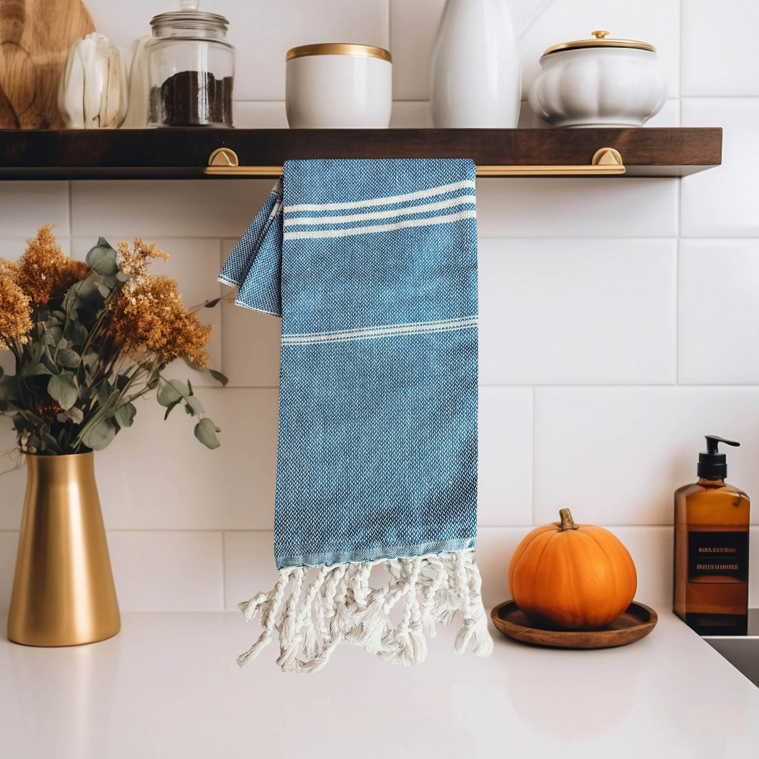 Luxurious oversized Turkish hand towel with bamboo tassels, showcasing vibrant colors and elegant design.