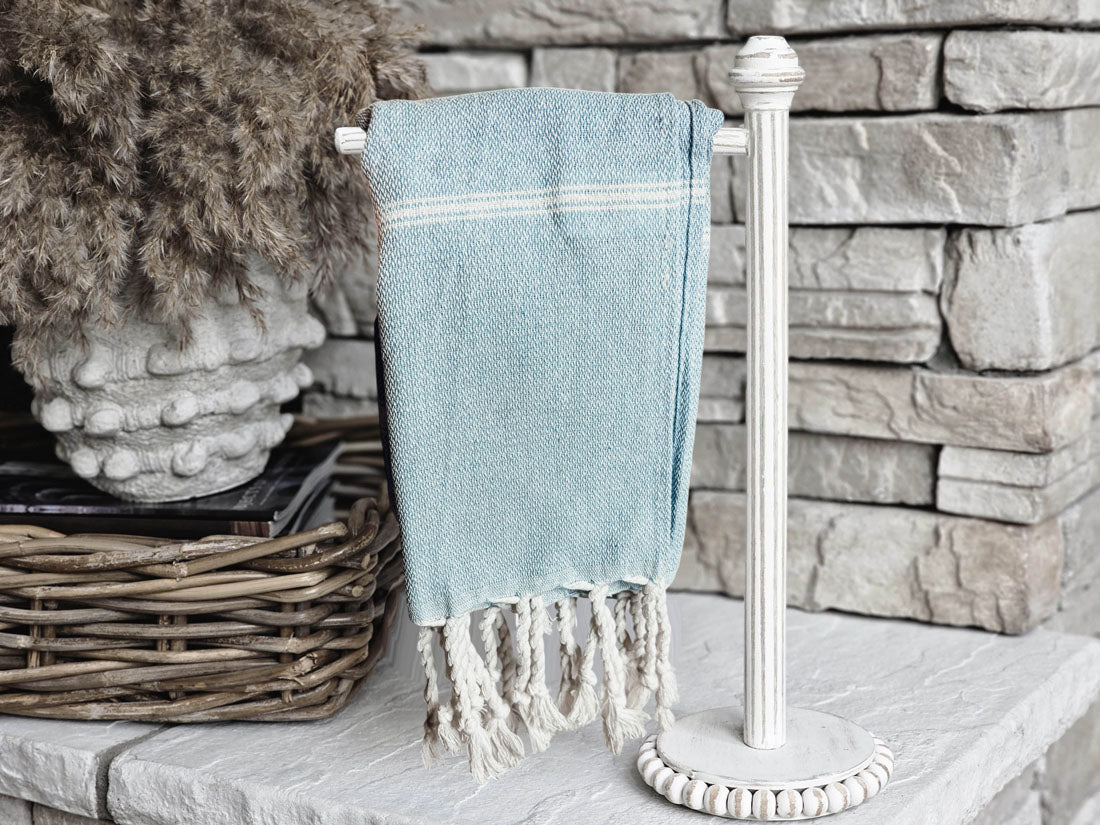 Luxurious oversized Turkish hand towel with bamboo tassels, showcasing vibrant colors and elegant design.
