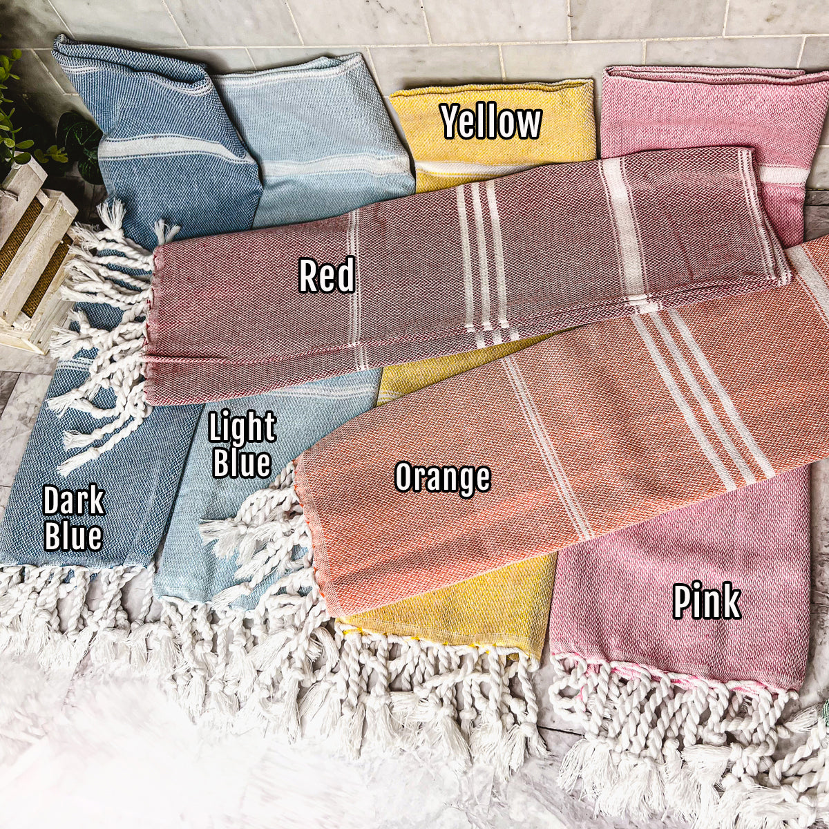 Luxurious oversized Turkish hand towel with bamboo tassels, showcasing vibrant colors and elegant design.