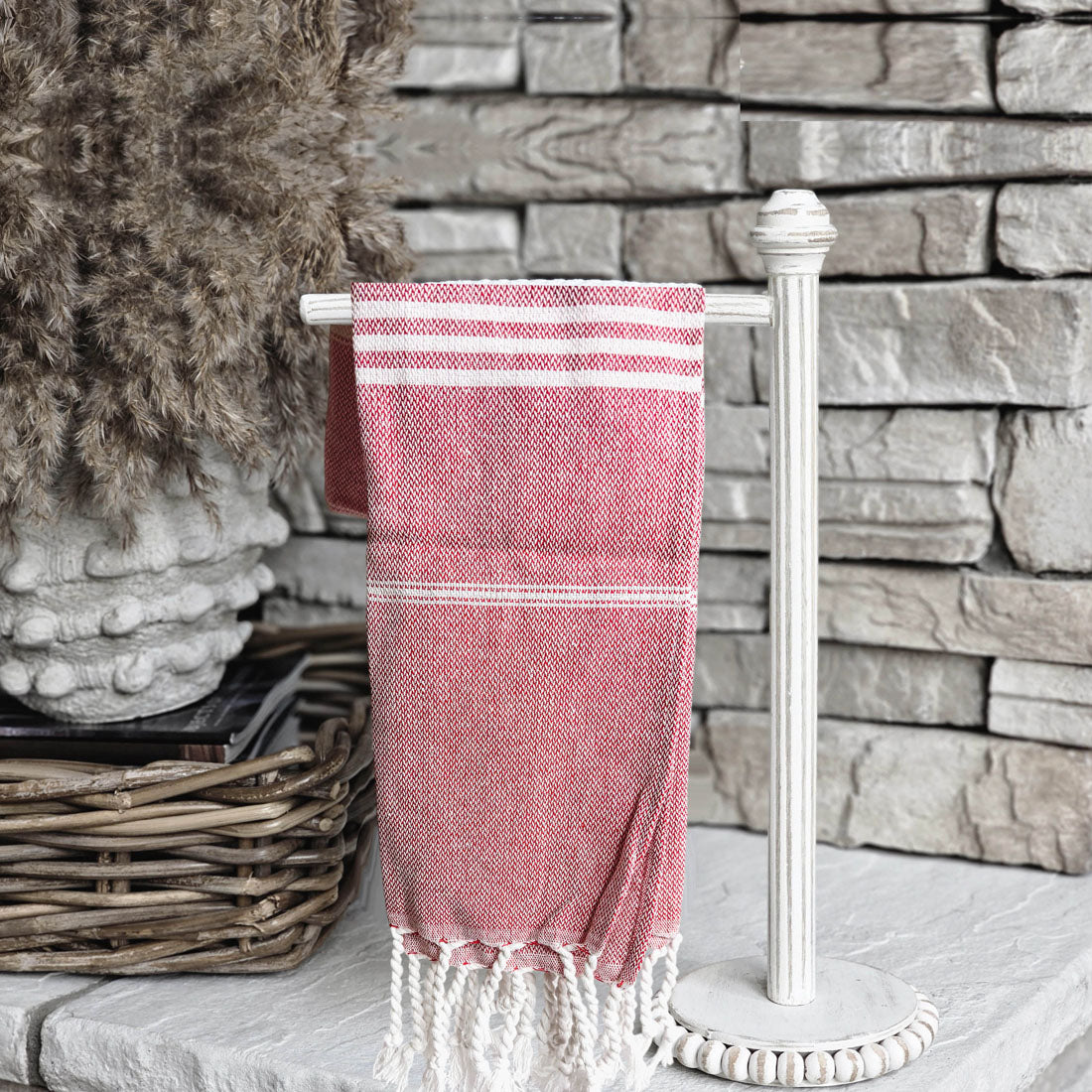 Luxurious oversized Turkish hand towel with bamboo tassels, showcasing vibrant colors and elegant design.