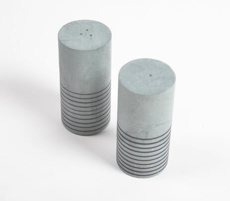 Elegant Turned Grey Stone Salt and Pepper Shakers, showcasing polished natural stone craftsmanship.