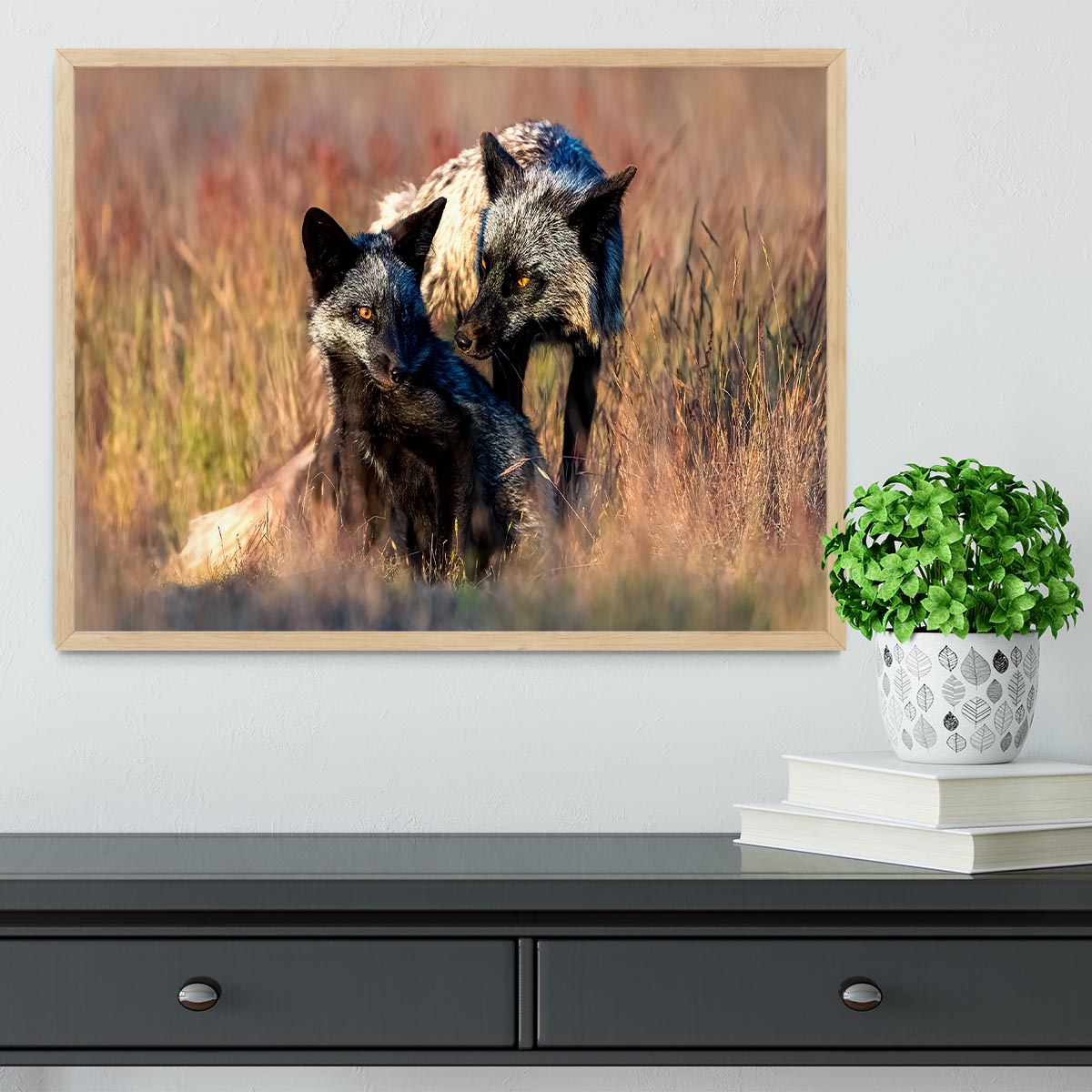 A beautifully framed print of two black foxes, showcasing their elegance in a stylish handmade frame.