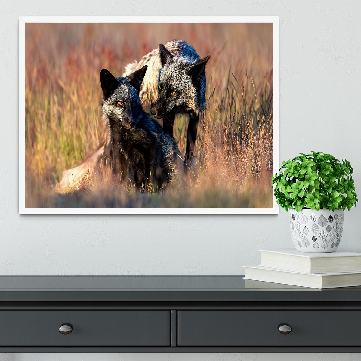 A beautifully framed print of two black foxes, showcasing their elegance in a stylish handmade frame.