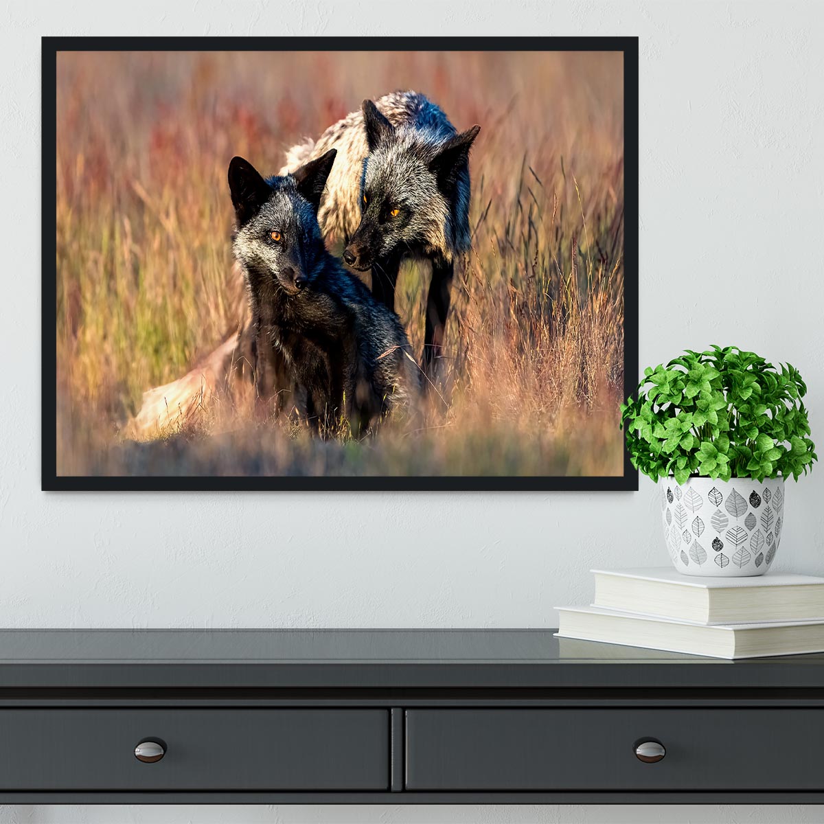 A beautifully framed print of two black foxes, showcasing their elegance in a stylish handmade frame.