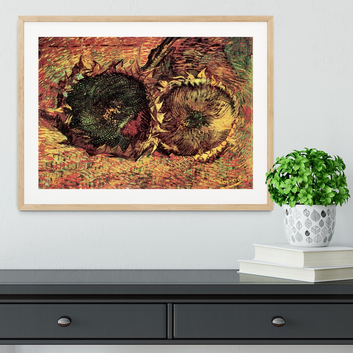 Framed print of Van Gogh's Two Cut Sunflowers, showcasing vibrant colors and intricate details in a stylish frame.