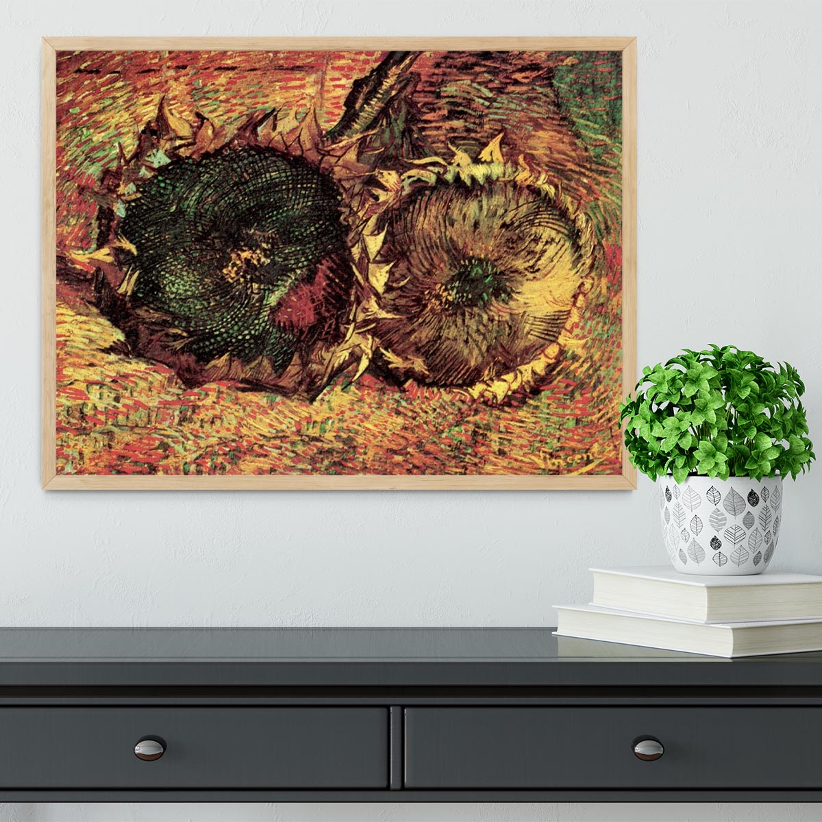Framed print of Van Gogh's Two Cut Sunflowers, showcasing vibrant colors and intricate details in a stylish frame.