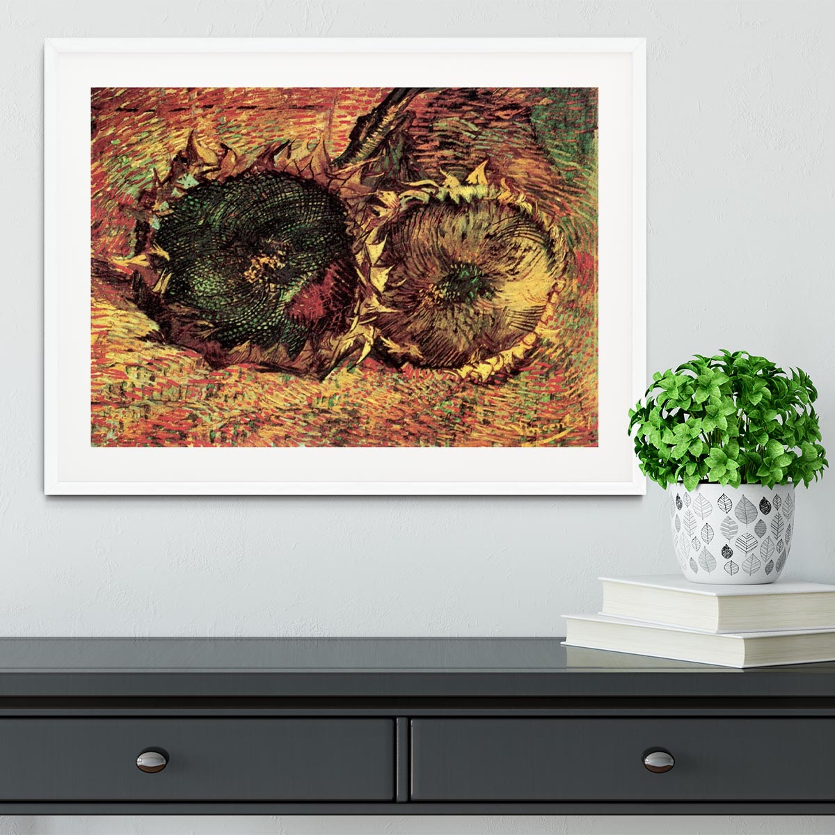 Framed print of Van Gogh's Two Cut Sunflowers, showcasing vibrant colors and intricate details in a stylish frame.