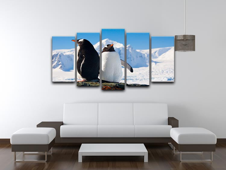 A beautiful 5-split canvas artwork featuring two penguins dreaming together on a rock, creating a serene and charming atmosphere.