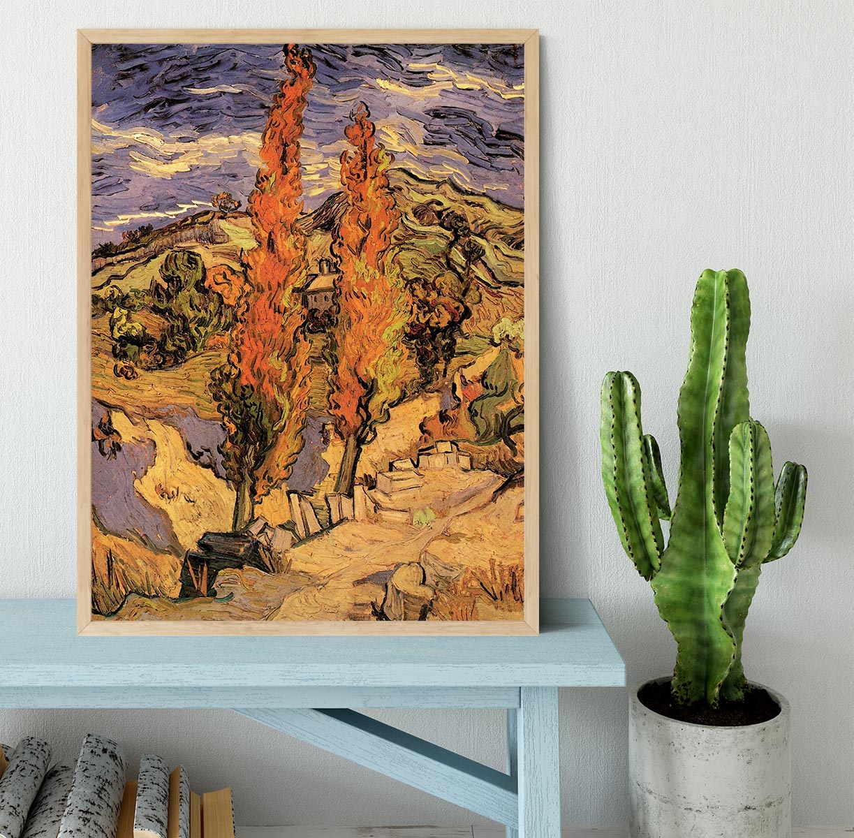 Framed print of Van Gogh's 'Two Poplars on a Road Through the Hills' showcasing vibrant colors and intricate details.