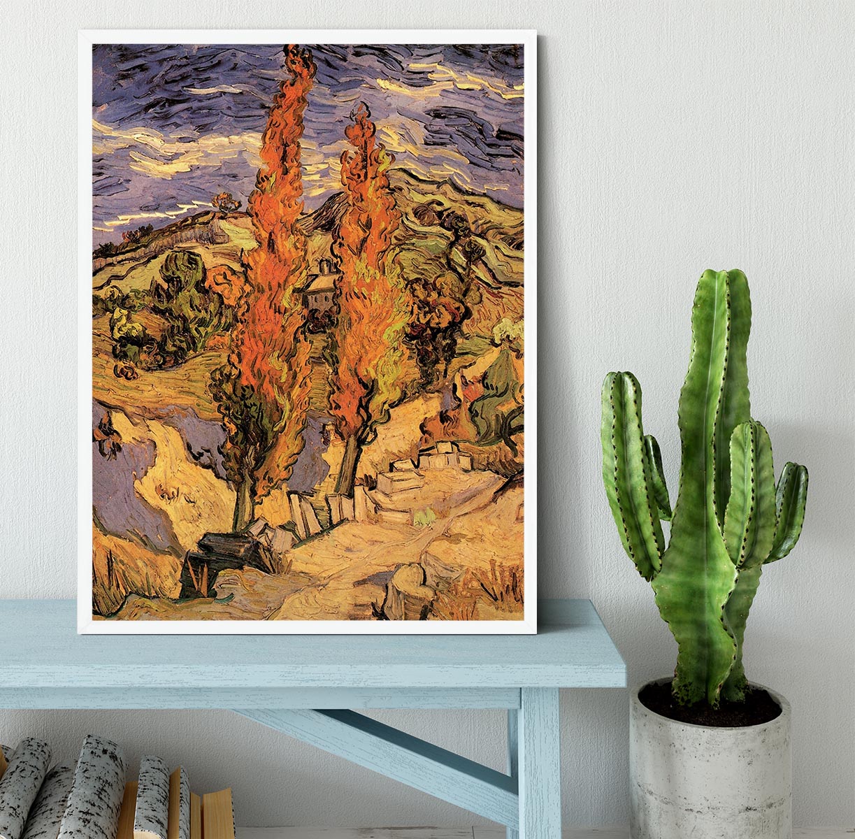 Framed print of Van Gogh's 'Two Poplars on a Road Through the Hills' showcasing vibrant colors and intricate details.