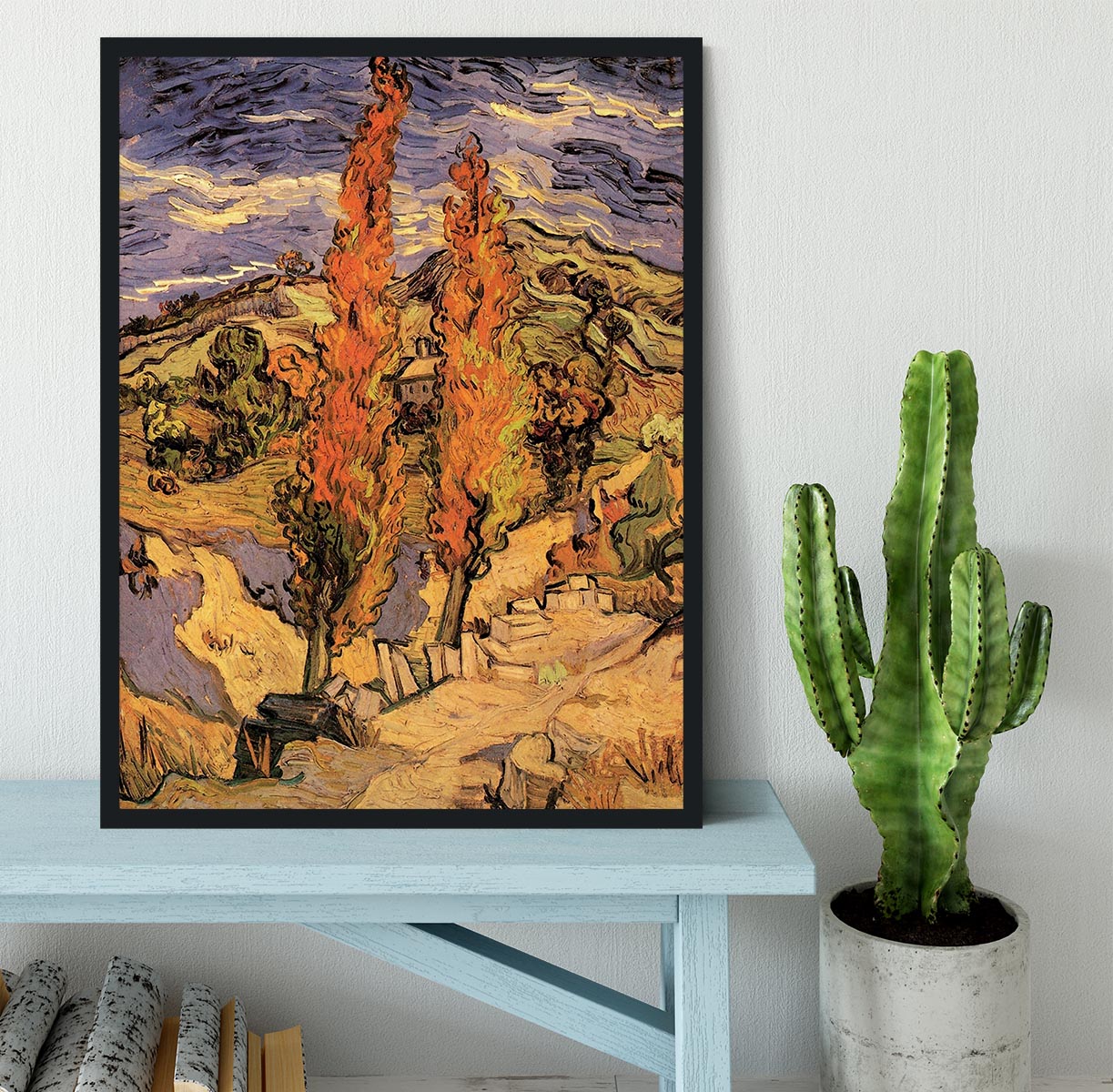 Framed print of Van Gogh's 'Two Poplars on a Road Through the Hills' showcasing vibrant colors and intricate details.