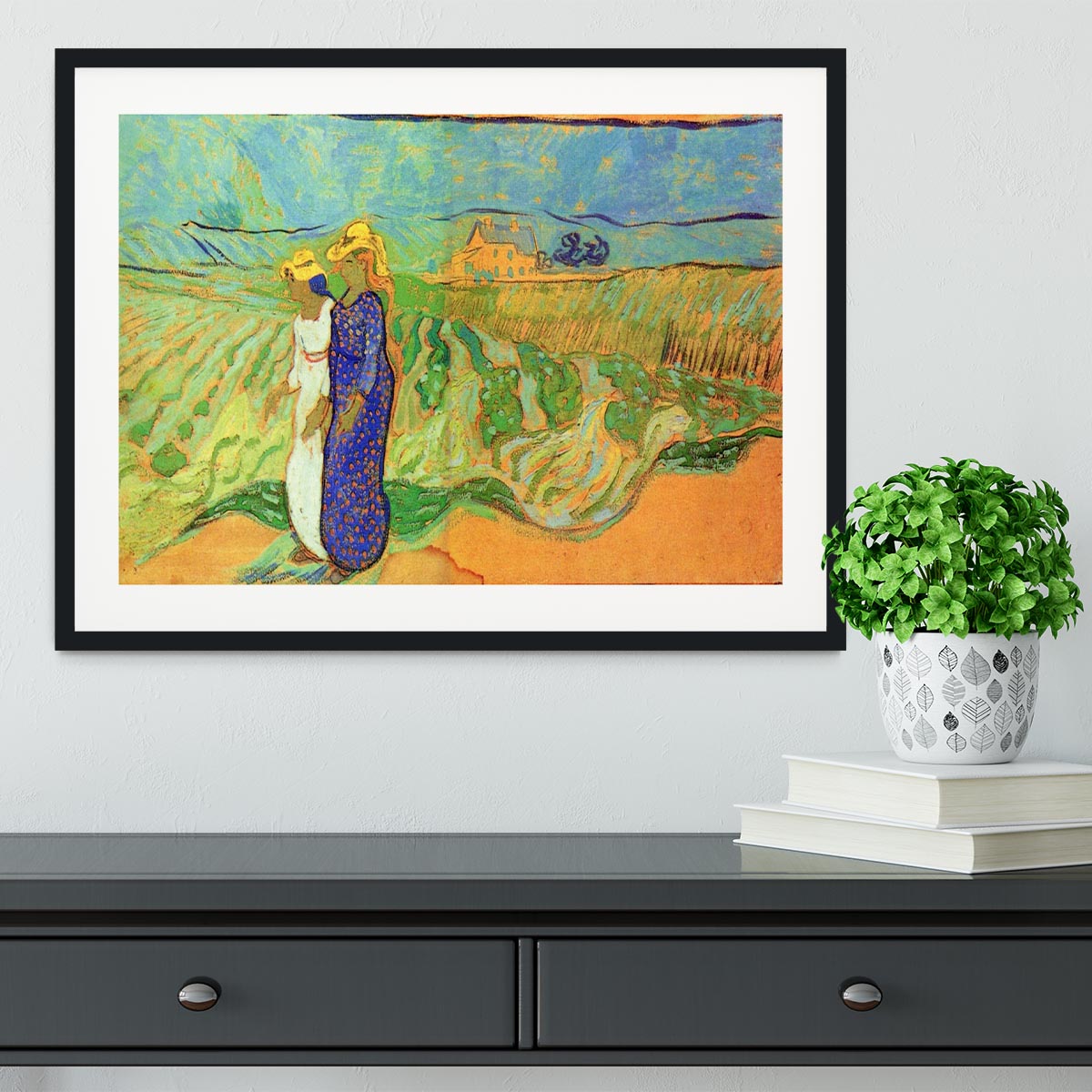 Framed print of Van Gogh's Two Women Crossing the Fields, showcasing vibrant colors and intricate details.