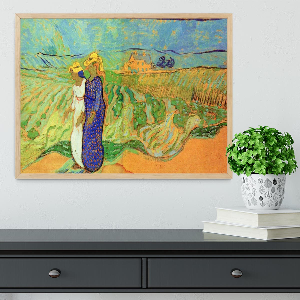 Framed print of Van Gogh's Two Women Crossing the Fields, showcasing vibrant colors and intricate details.