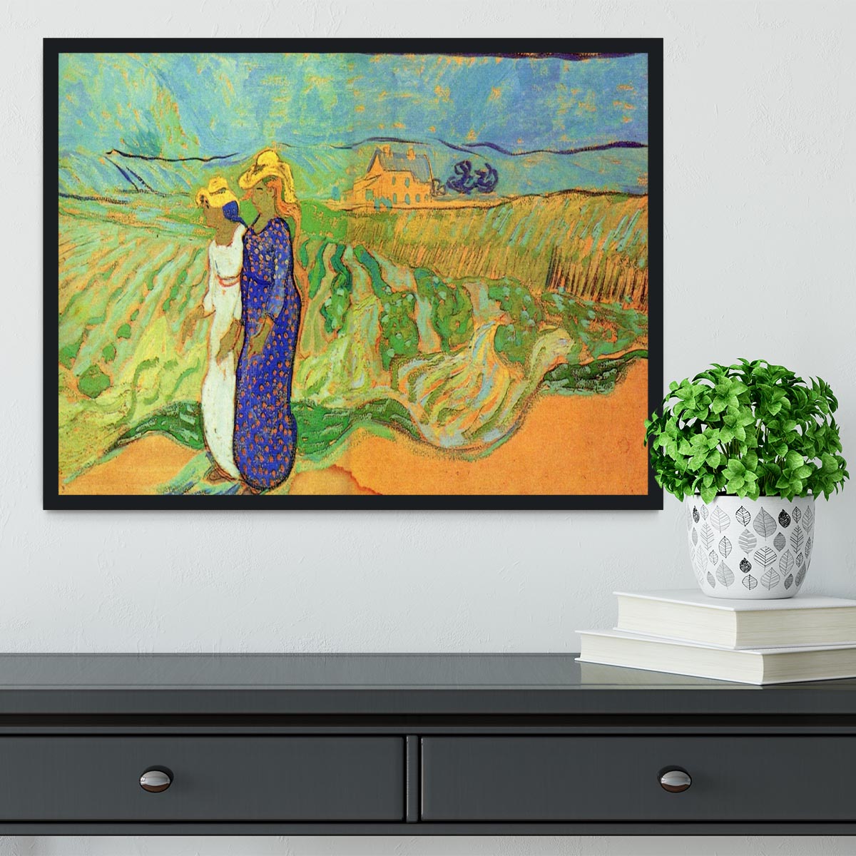 Framed print of Van Gogh's Two Women Crossing the Fields, showcasing vibrant colors and intricate details.