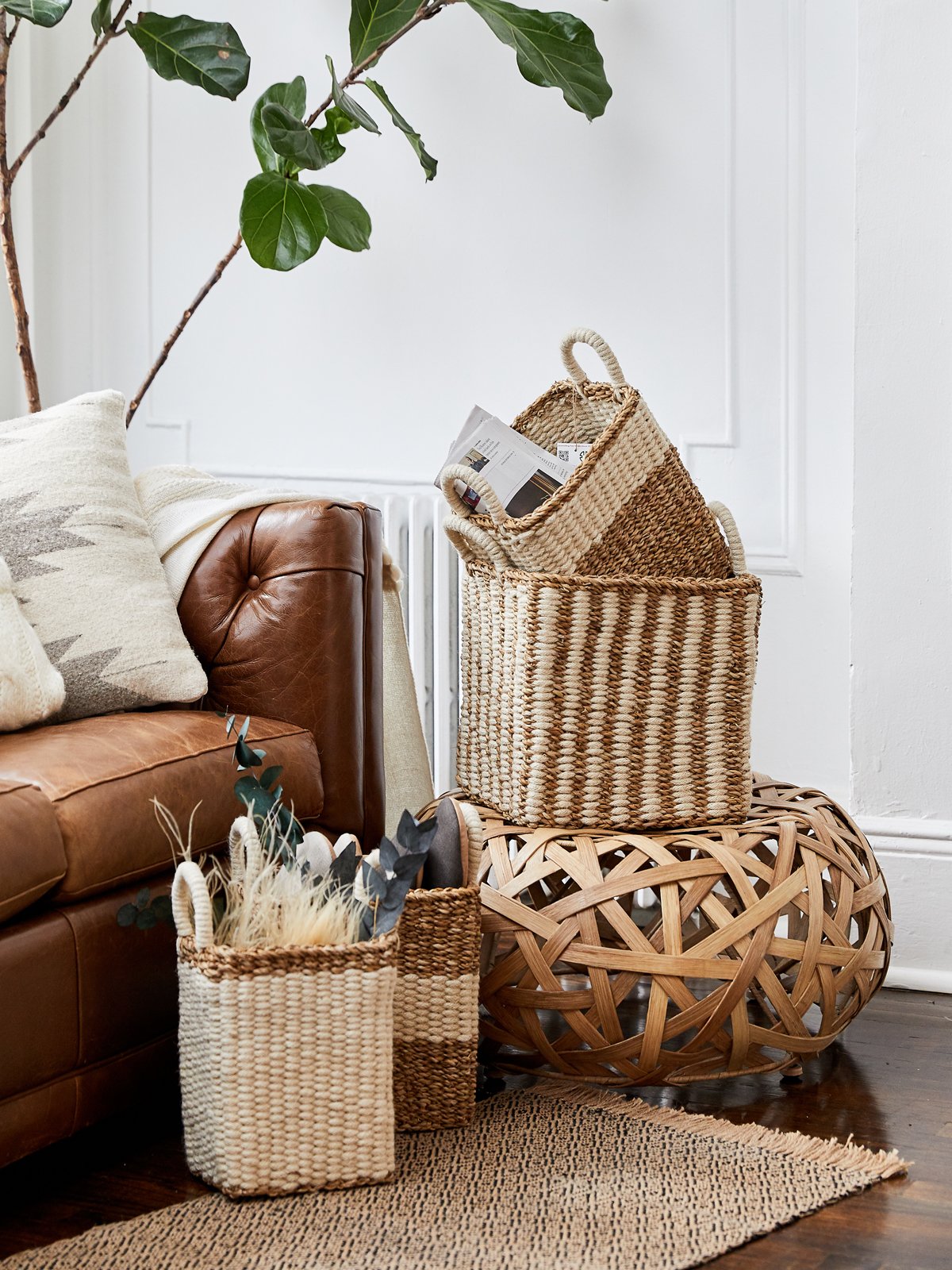 Ula Storage Basket made from seagrass and jute, showcasing its natural and white color, perfect for home organization.