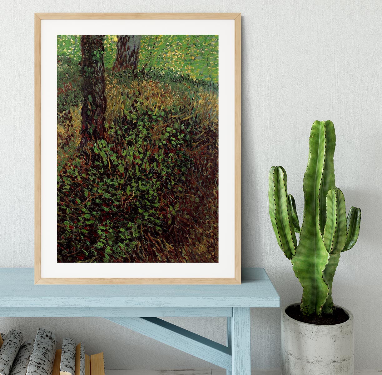 Framed print of Van Gogh's Undergrowth artwork, showcasing vibrant colors and intricate details in a handmade frame.