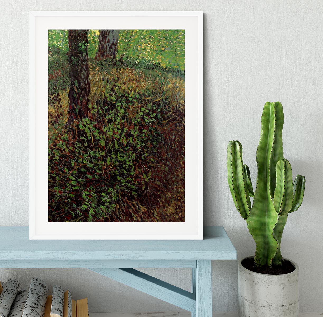Framed print of Van Gogh's Undergrowth artwork, showcasing vibrant colors and intricate details in a handmade frame.