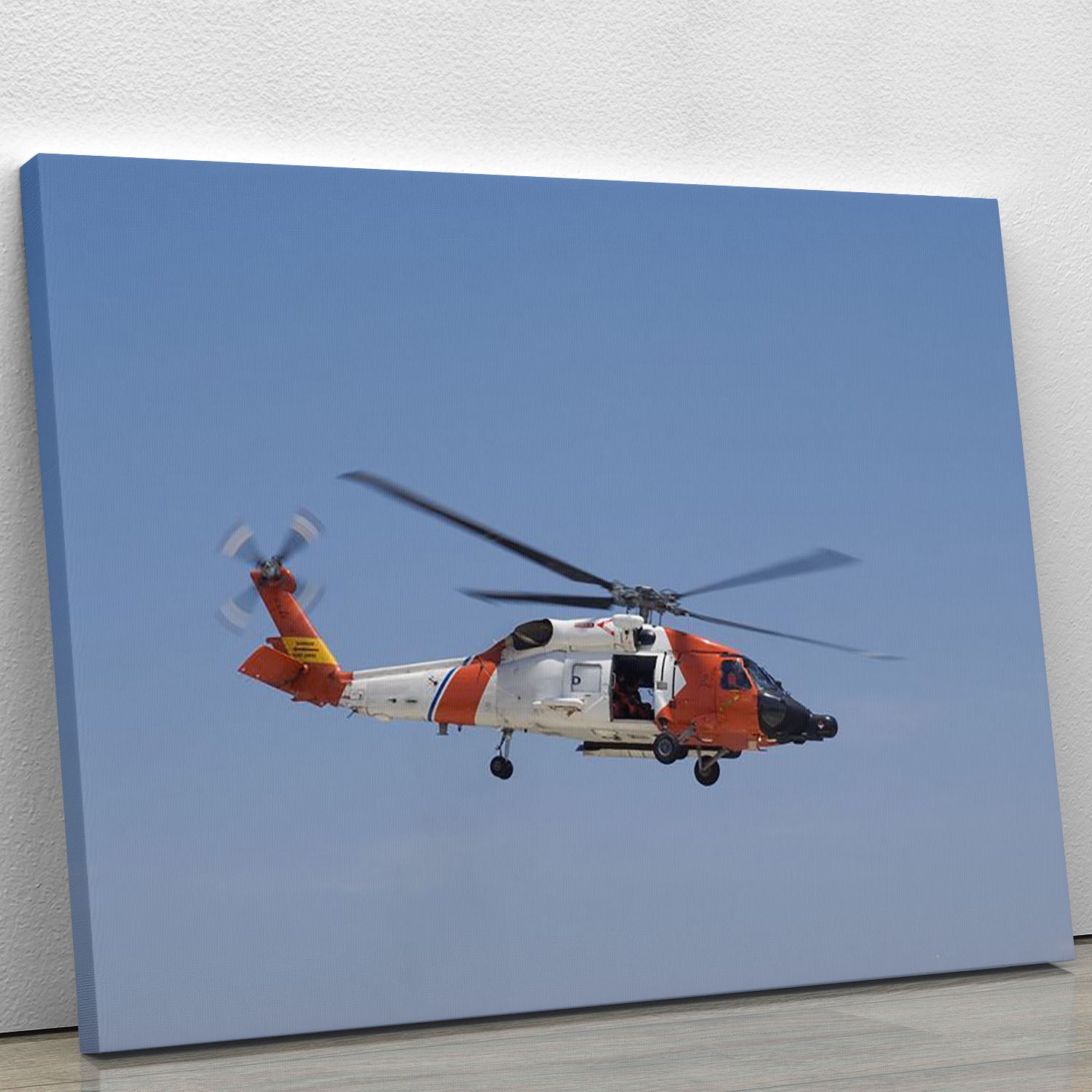 Canvas print of a United States Coast Guard helicopter, showcasing vibrant colors and detailed design, perfect for home or office decor.